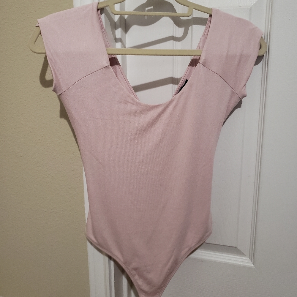 Express Light Pink Strappy Bodysuit. NEVER WORN